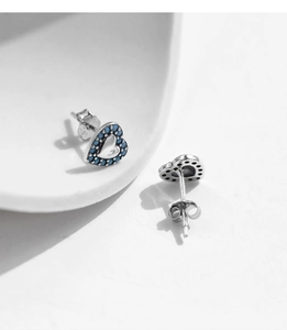 Close-up of S925 sterling silver heart-shaped stud earrings with blue turquoise inlay