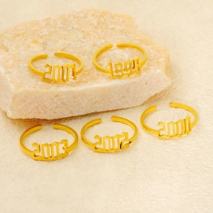 Adjustable gold stainless steel rings with gothic birth year numbers 1999 to 2003