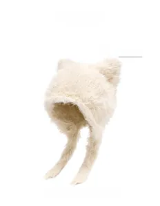 Detailed texture of beige plush bear ear hat with soft fluffy material and long earflaps