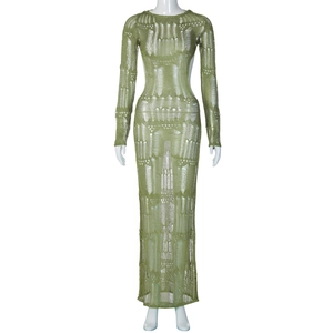 Green long sleeve knit dress featuring a hollow-out crochet pattern and maxi length