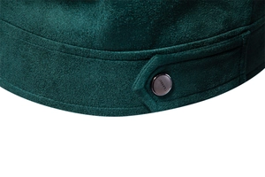 Detailed macro view of dark green suede jacket hem with a metal CLASSIC button