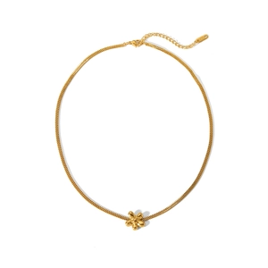 Detailed close-up of 18k gold plated flower pendant necklace with adjustable extension chain