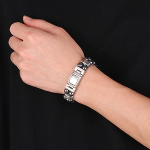 Men's double row hematite beaded bracelet with matte stainless steel folding clasp on wrist