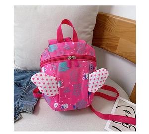 Detail of pink toddler backpack with angel wings and cute cartoon rabbit patterns