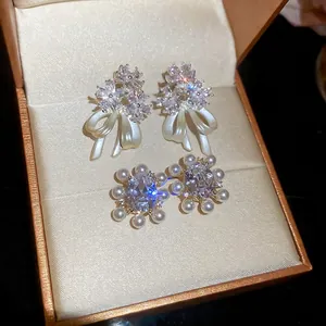Exquisite 14k gold plated flower and pearl earrings set in a premium velvet gift box