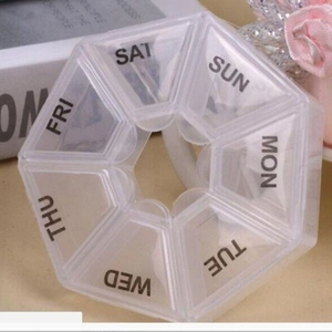 Octagonal 7-day pill organizer box in transparent plastic with daily week abbreviations