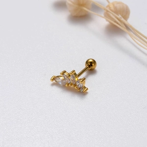 Macro view of gold crown earring with marquise and round cubic zirconia inles