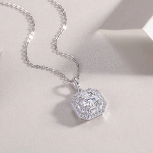 Macro shot of silver hexagon necklace pendant with shimmering lab-grown diamond center