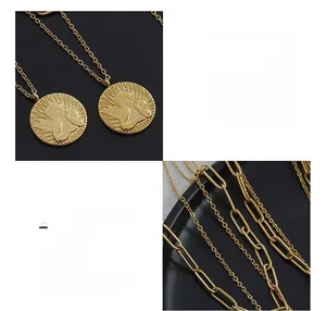 Detail of 18K gold-plated titanium steel double-layer necklace with angel pendant