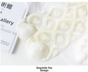 Detailed view of exquisite toe stitching on white mesh socks with heart flocking pattern