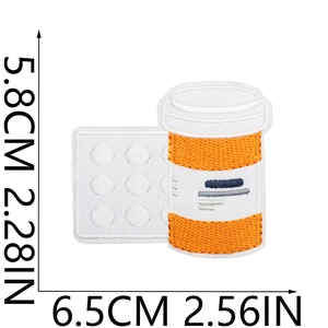 Size detail of medical pill patch with dimensions 5.8x6.5cm showing embroidery texture