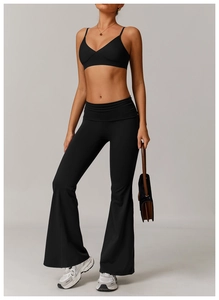 Detail view of black V-neck sports bra and high-waisted flared yoga leggings for women