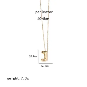 Macro view of gold 3D bubble letter J pendant with technical dimensions and fine chain