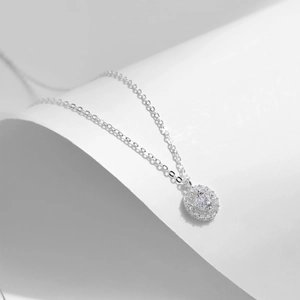 Elegant S925 sterling silver round pendant necklace with halo crystal on white background