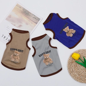 Close-up of three breathable summer pet vests with teddy bear prints in blue, gray, and khaki