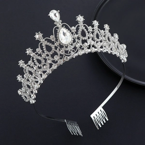 Detail showing crystal bridal tiara with sparkling pear-shaped rhinestones and side combs