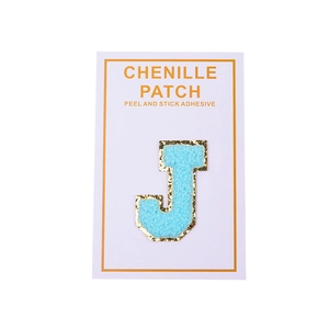 Blue chenille letter J patch with gold sequins and self-adhesive back on card