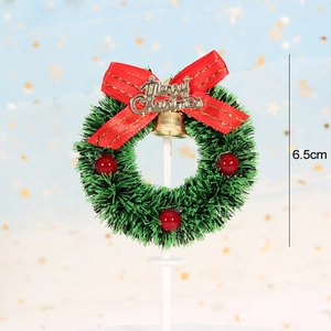 Miniature Christmas wreath cake topper with red bow, gold bell and 6.5cm size label