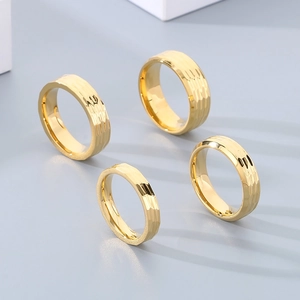 Golden textured titanium steel rings for women and men featuring a luxury hammered finish