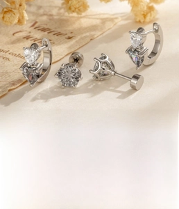 Detail of silver heart zircon earrings made of titanium steel with size 0.8x6mm