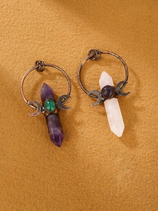 Detailed close-up of retro crescent moon pendants with amethyst and chalcedony crystals