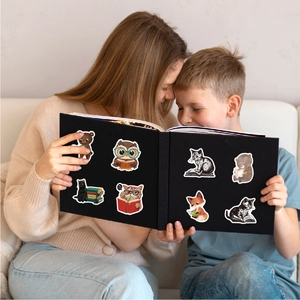 Waterproof reading stickers featuring cute cartoon animals on a notebook with a child