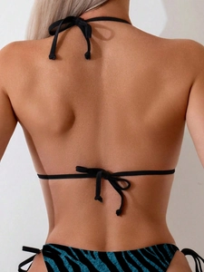 Detail view of bikini back with black halter ties and blue zebra print bottoms
