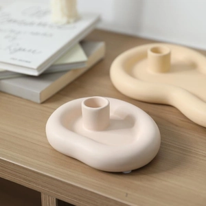 Modern Nordic cloud-shaped ceramic candle holders in cream yellow and pink matte finish