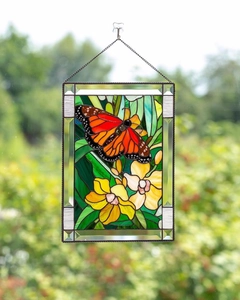 Stained glass panel with monarch butterfly and yellow flowers on a metal chain