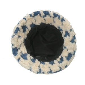 Blue and white patterned plush fisherman hat featuring soft faux fur and black fabric lining