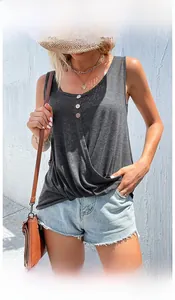 Detail of grey sleeveless tank top showing round buttons and textured cotton fabric