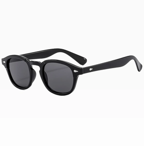 Detailed 45-degree side view of vintage round sunglasses with silver diamond rivets