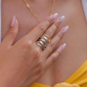 Minimalist multi-layer wavy interlocking ring in two-tone 18K gold and stainless steel