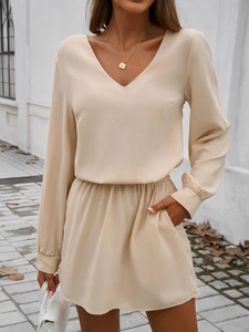 Ensemble chic haut à manches bouffantes et jupe trapèze abricot avec poches
