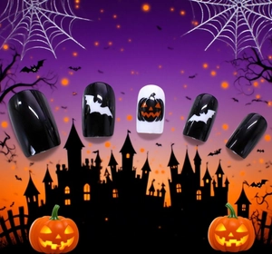 Halloween press-on nails featuring white bats and pumpkin designs on festive background