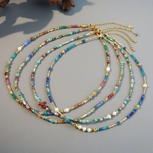 Bohemian multilayered turquoise and coral beaded necklace set with golden spacers