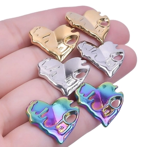 Detailed macro view of 304 stainless steel heart pendants with liquid metal lava texture