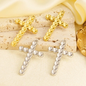 Detailed view of 304 stainless steel cross pendant settings in gold and silver finishes