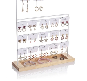 Three-tier white iron earring display stand with natural wooden base for jewelry storage