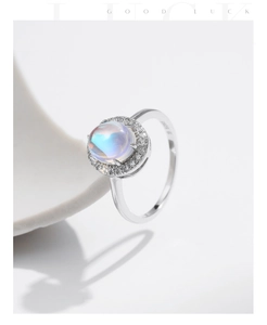 Macro shot of S925 hallmark on silver ring with halo set blue moonstone centerpiece