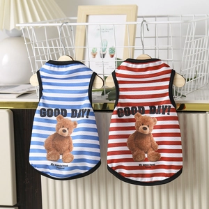 Detail of breathable striped dog vests in blue and red with cute teddy bear prints
