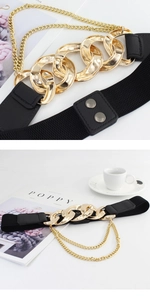 Close-up of women's black elastic waist belt with bold gold metal chain and dual snap buckle