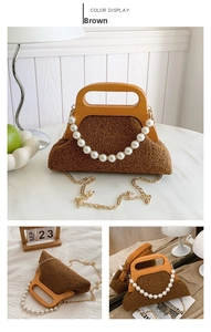 Detail of brown plush faux fur evening bag with wooden handle and pearl chain strap