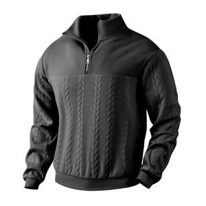 Men's black waffle knit half-zip sweater with cable stitch patterns and stand collar