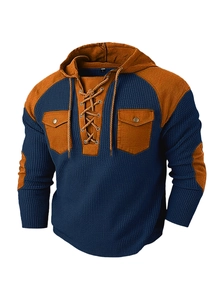 Detailed waffle texture of navy blue mens hoodie with contrast drawstring and pockets