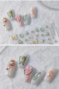 Detail of 5D butterfly nail stickers featuring iridescent gradients and 3D chain accents