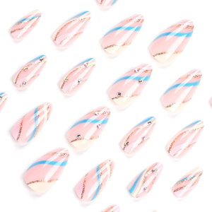 Almond press-on nails with pastel wavy stripes, gold glitter accents and colorful rhinestones