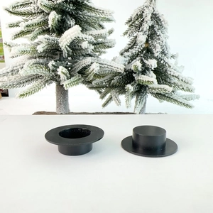 Close-up of mini cow-print plastic hats for DIY crafts with a festive backdrop