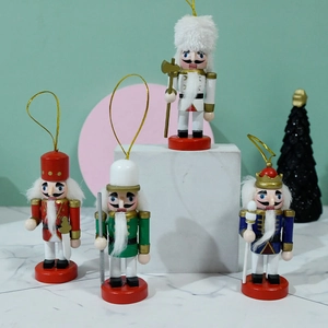 Set of four 10cm wooden Christmas nutcracker soldiers in red green blue and white