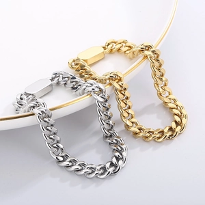 Detailed view of hip-hop style Cuban chain bracelets in gold and silver stainless steel